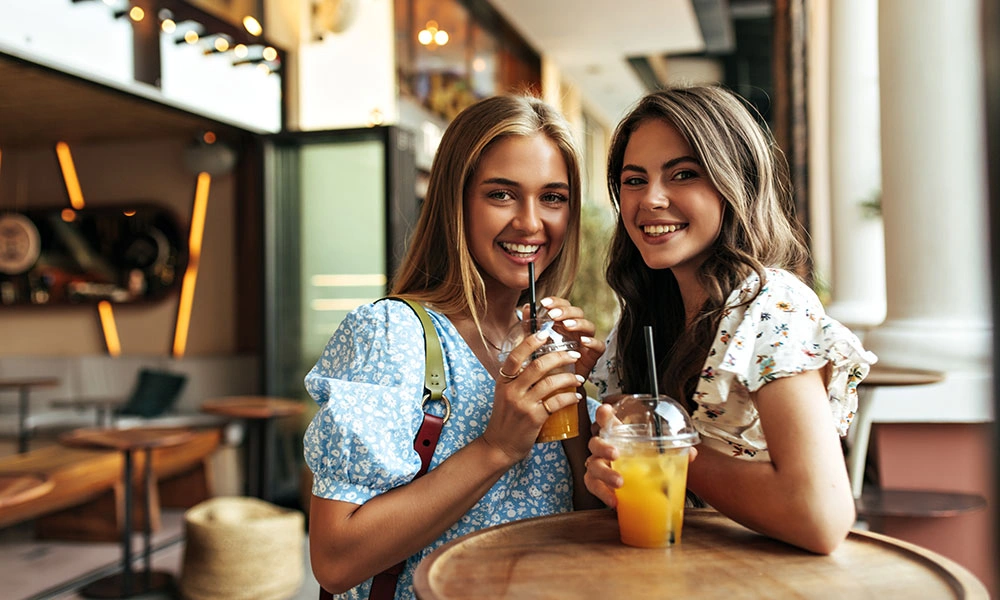 Women Enjoying Zero Proof Cocktails at Cafe